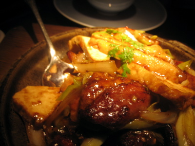 Duke of Berkshire pork belly, salted fish, dry chilis, szechuan peppers and baby leek in clay pot